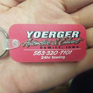 A red keychain with logo. 