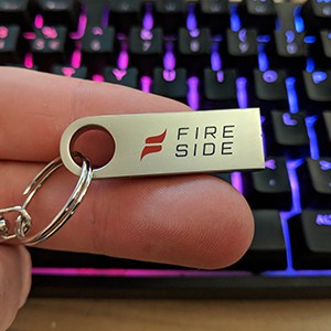A Stealth USB drive and keychain with logo. 