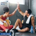 Two people high fiving after a workout.