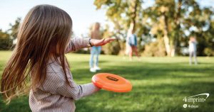 Child catching a sport flyer.