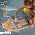 Child coloring with sidewalk chalk.