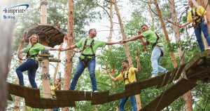 Group of people participating in an obstacle course.