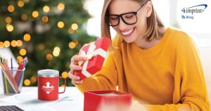 Smiling woman opening a gift box.