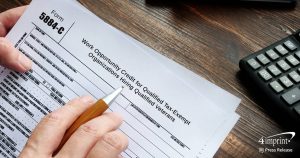 Person filling out a form for hiring veterans