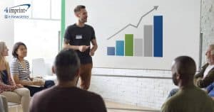 Man gives a presentation with a chart showing revenue growth over time.