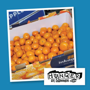A large box of oranges.