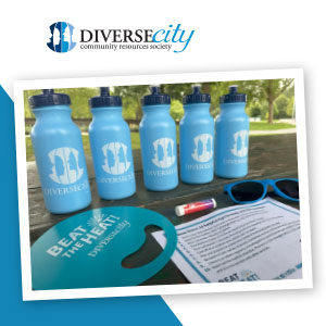 An array of branded promo products on a picnic table.