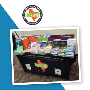 A branded table holding boxes of children’s books.