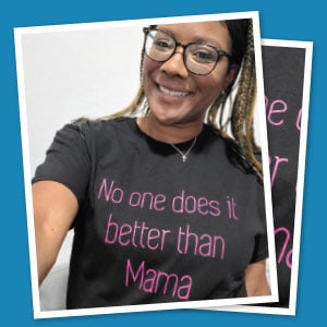 Woman wearing T-shirt imprinted with, “No one does it better than Mama.”