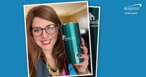 Woman wearing glasses is holding a turquoise metallic tumbler imprinted with a logo.