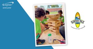 Photo children playing a block-stacking game.