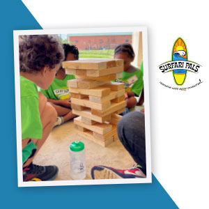 Photo children playing a block-stacking game.