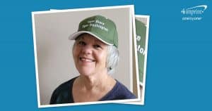 Woman wearing a branded baseball cap.