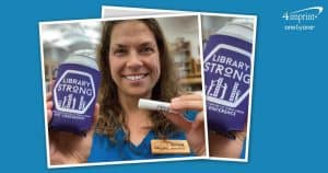 Library employee holding branded lip balm and a drink in a can cooler.
