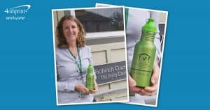 Woman holding a green water bottle with a logo.