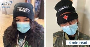 Image of two YEG Youth Connect clients wearing branded toque
