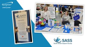 Branded banner and other marketing materials on a table at an exhibit.