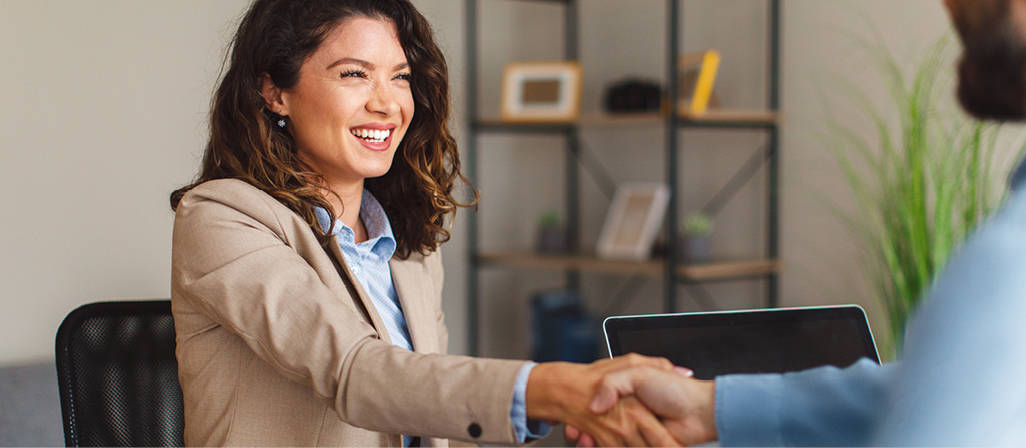 A woman shakes hands with someone