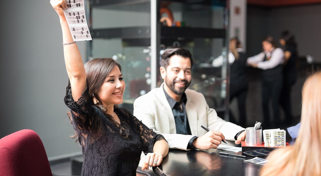 People playing bingo at company fundraiser