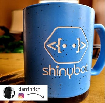 Blue branded coffee mug that says "shinybot"