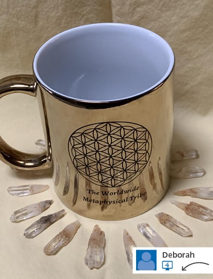 Gold metallic coffee mug surrounded by arrowheads