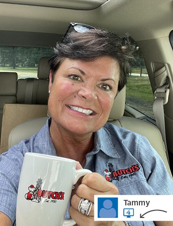 Woman smiling and holding a branded white mug