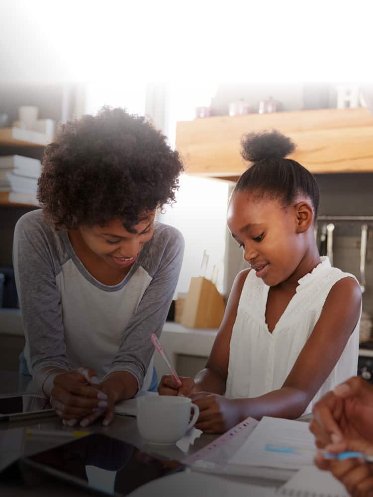 Mother and daughter working on homework together.