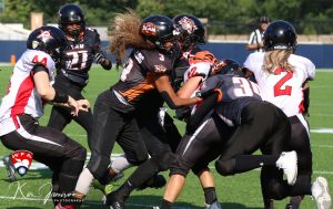 Football team playing championship game for Women's Football Alliance