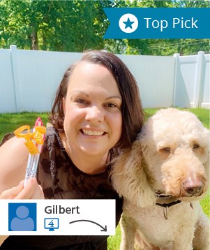 A social post of a dog walker, her promo pens and a dog.