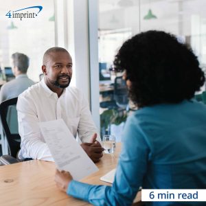 Woman interviewing a man while looking at his resume - 6 minute read