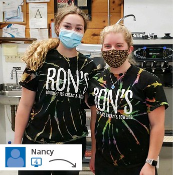 Two girls in tie-dye shirts.