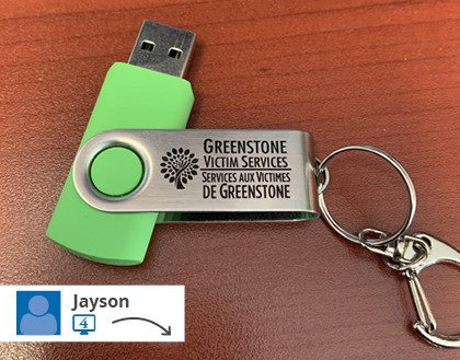 A green USB drive with a logo.