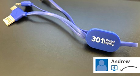 A blue charging cable with a logo.
