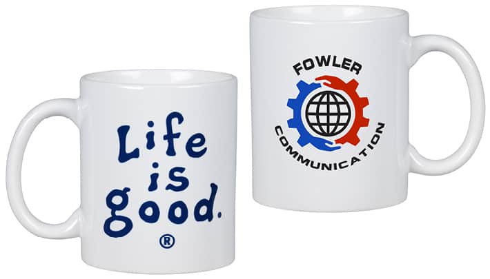 A white coffee mug with a Life is Good logo on one side.