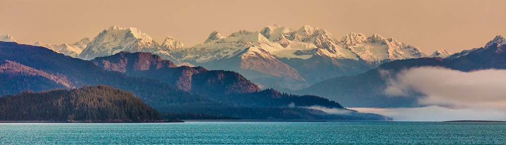 view of alaskan mountain landscape from the ocean