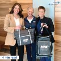 3 Major Health Partners employees holding 2 branded coolers - business care packages