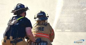 Firefighter and adult student doing training activity at Fire Camp