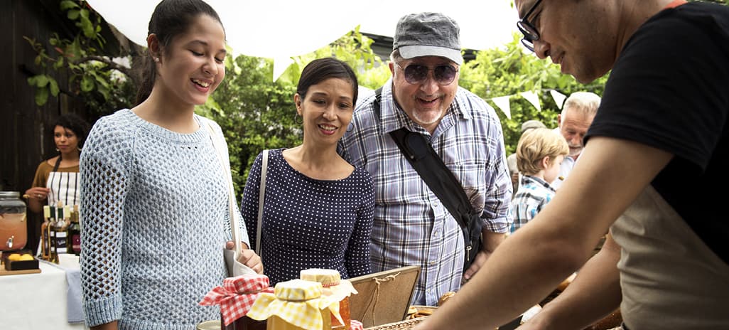 family shopping at farmers market