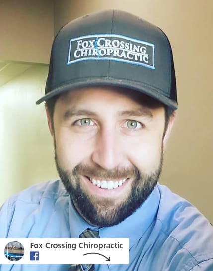 man wearing Fox Crossing Chiropractic branded ball cap