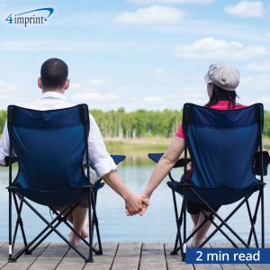 couple holding hands while sitting in bag chairs while looking at lake - 2 min read time