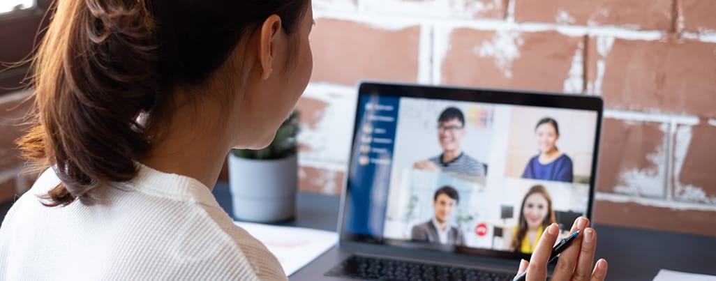 Woman on a zoom call with co-workers