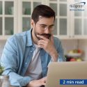 Man at home looking at laptop - 2 minute read