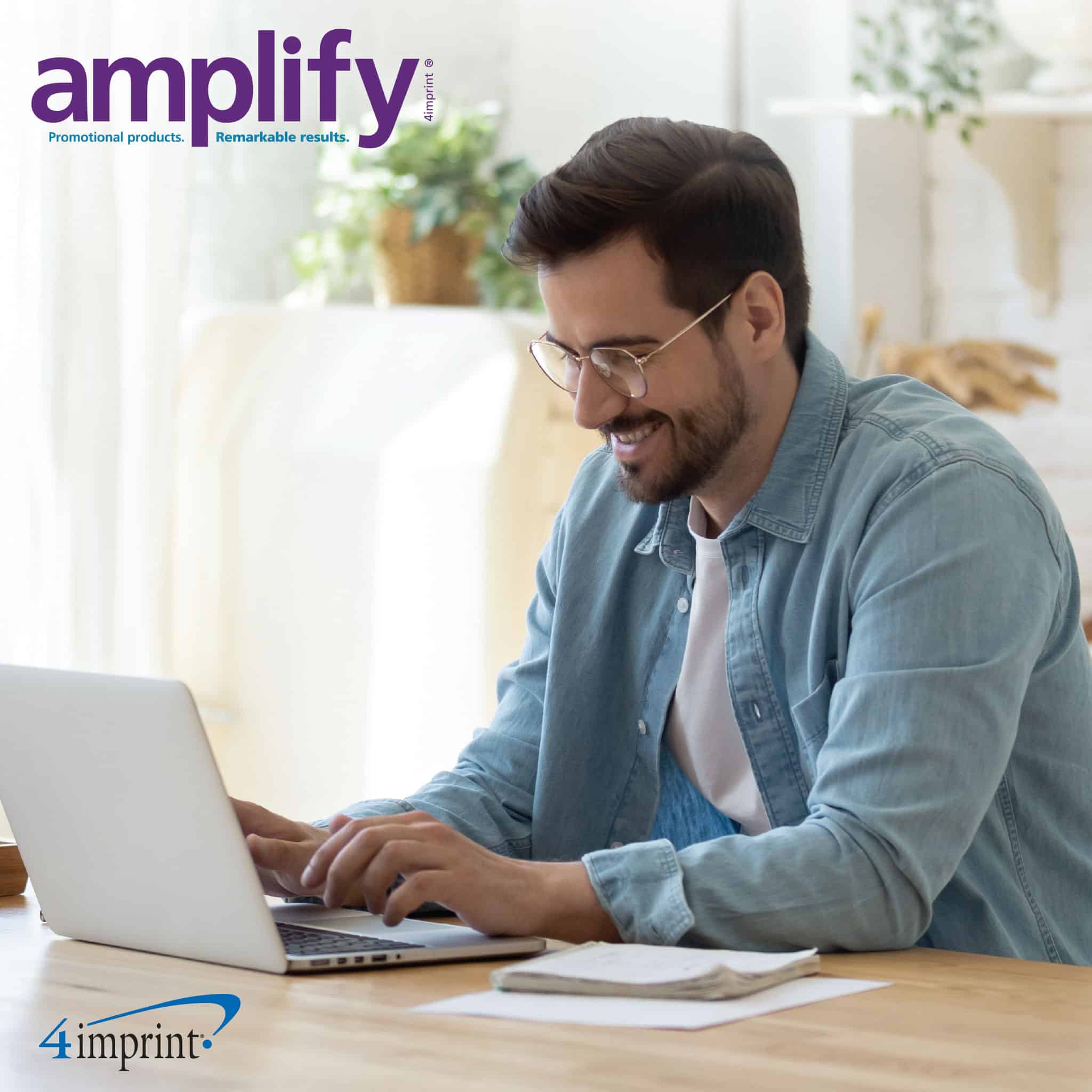 man working on computer from home - cover image from amplify digital magazine