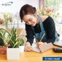 Person working in plan shop writing FSC certified wood pencil and paper