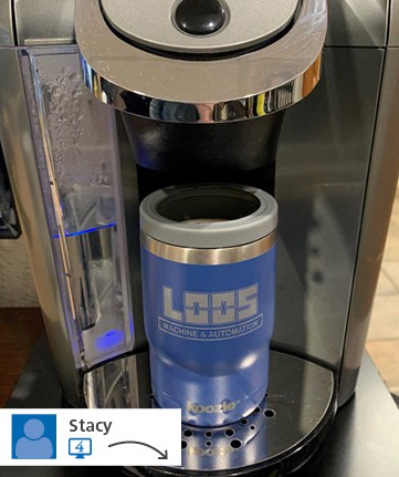 Promotional travel coffee mug in coffee dispenser