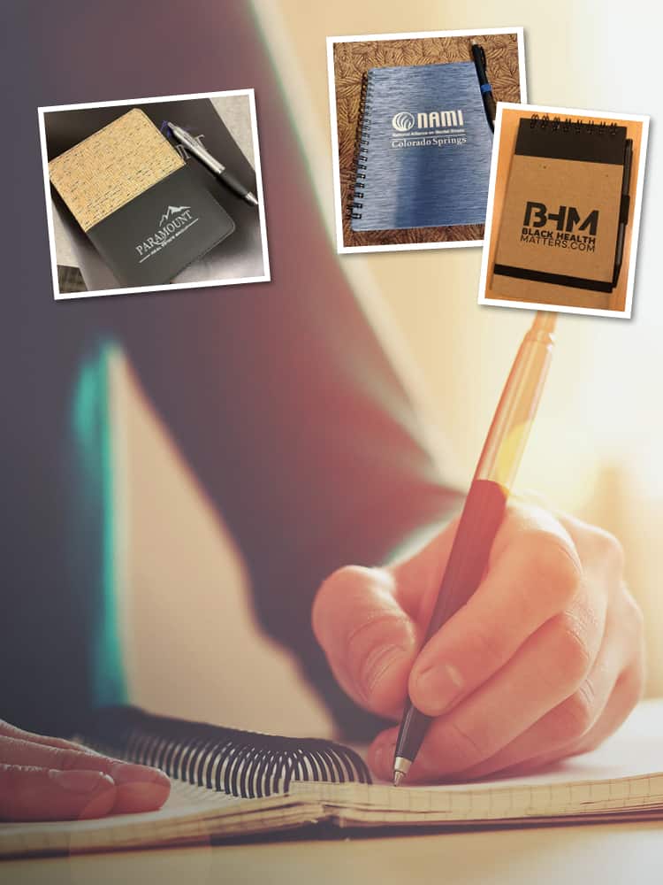 A selection of notebooks with logos on their covers.
