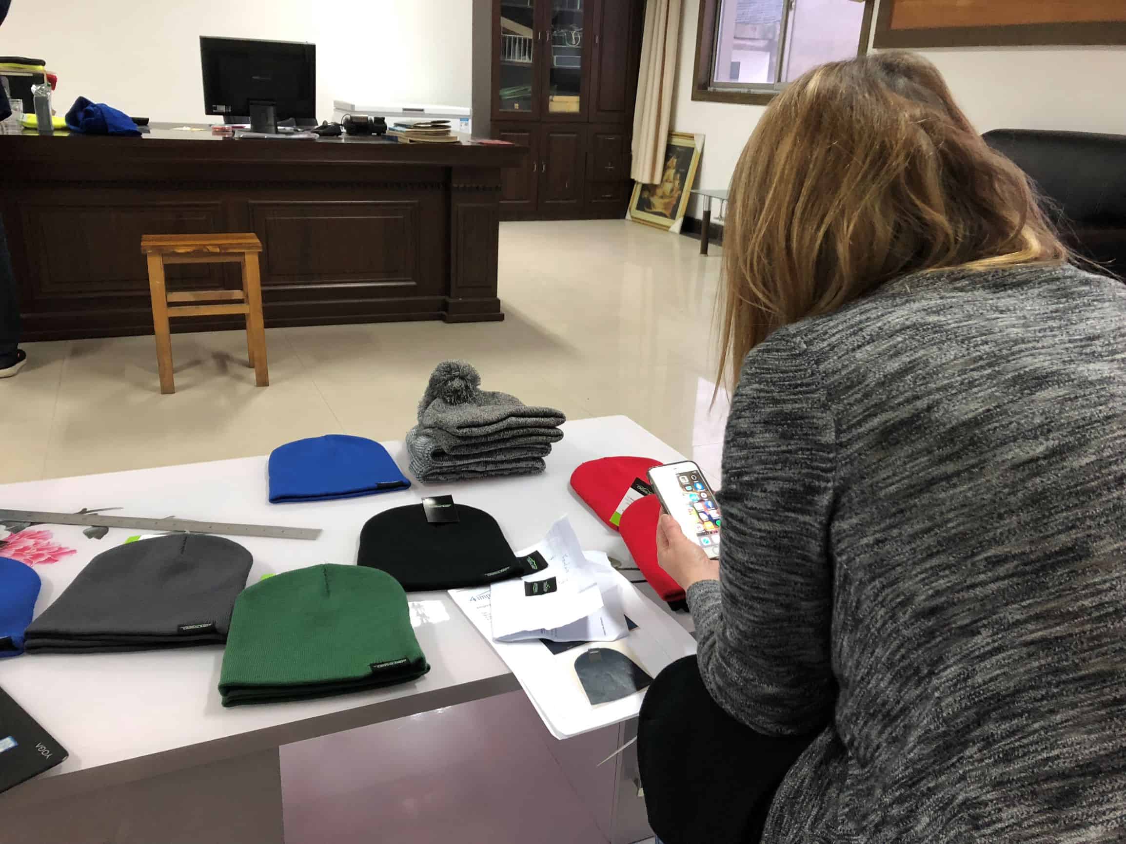 4imprint merchandiser reviewing the new Crossland promotional fleece beanie.