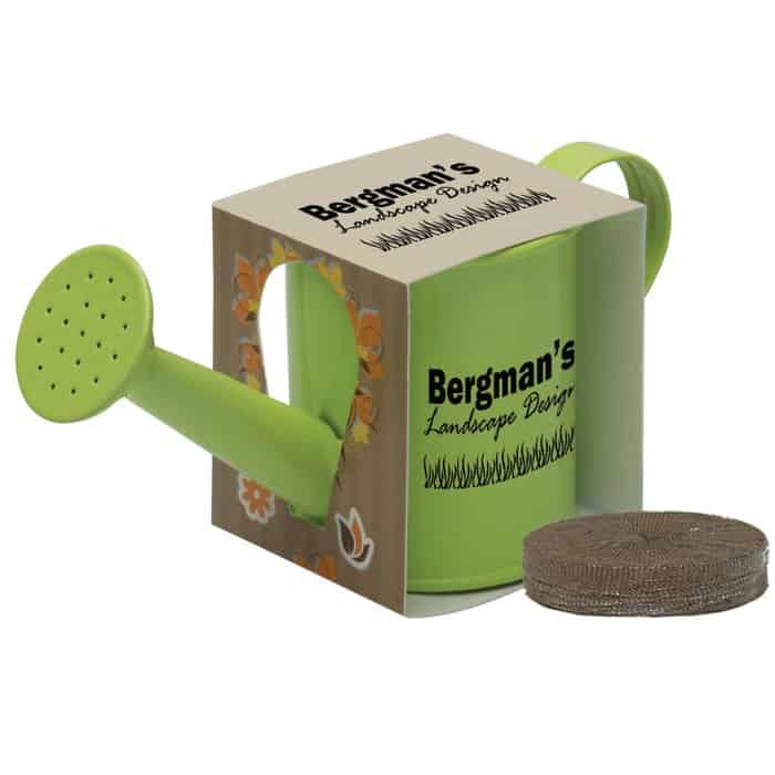 Green branded watering can planter kit with soil beside it