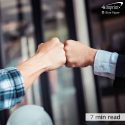 two people fist bumping - Content will be a 7 min read - represents the Blue Paper called - Build big business benefits with company community service