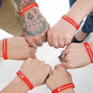 photo of 5 Wrists with personalized silicone bracelets through 4imprint’s one by one program